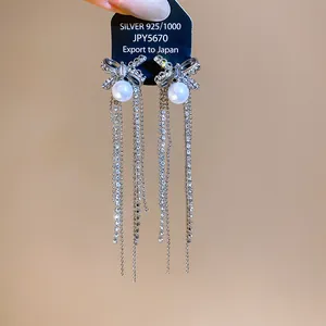 Elegant S925 silver needle bowknot tassel earrings with pearls and shimmering zircons