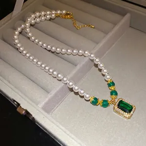 Vintage pearl necklace with emerald cut green zircon pendant and gold-tone chain