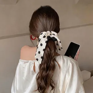 Elegant black and white polka dot satin bow scrunchie for French style ponytail
