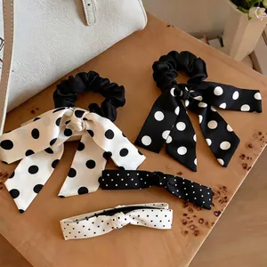 Elegant black and white polka dot satin scrunchies and hair bow ties set for women.