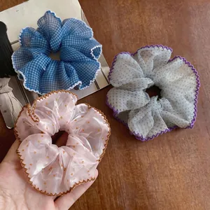Set of three stylish chiffon polka dot scrunchies with elegant scalloped edges