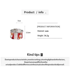 Detailed view of red geometric resin elastic bracelet with metal segments and measurements