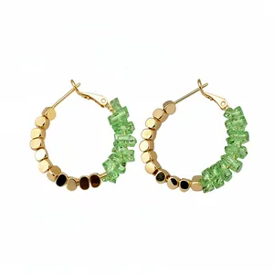 14K gold plated hoop earrings with faceted green crystals and crushed gold beads detail