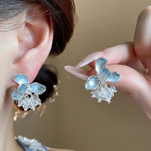 Elegant light blue floral earrings with sparkling crystal tassels and silver needle