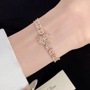 Detailed close-up of a gold-plated zircon bracelet with wheat ear flower design.