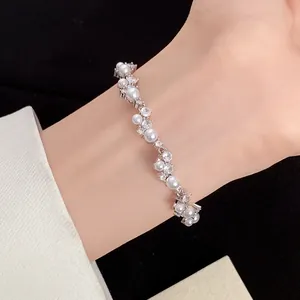 Close-up detail of an elegant irregular wheat leaf bracelet featuring zircon and pearls