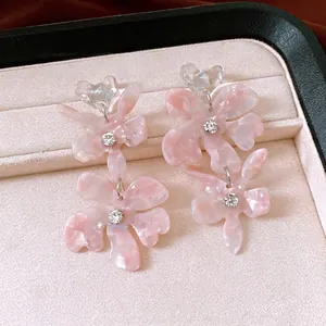 Elegant pink marbled flower tassel earrings with sparkling rhinestone heart accents for women.