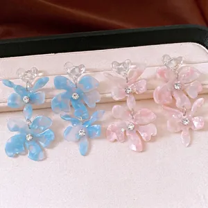 Elegant floral resin drop earrings with crystal heart top and sparkling rhinestone center