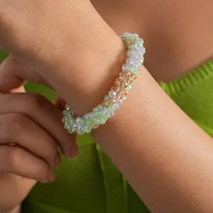 Detail shot of a sparkling multi-colored crystal beaded bracelet on a woman's wrist