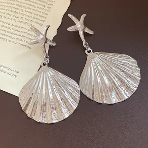 Vintage silver metallic shell and starfish drop earrings with unique pleated texture detail
