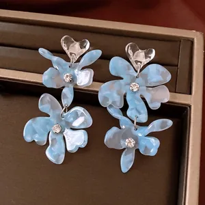 Elegant blue marble acrylic flower earrings with crystal heart studs