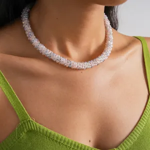 Close-up of model wearing a delicate pink and grey crystal beaded magnetic necklace