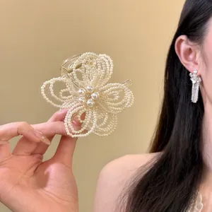 Elegant pearl flower hair claw clip detail with intricate beadwork design