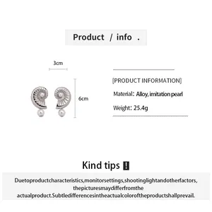 Detailed size and material information for these pearl conch shell drop earrings, 3cm by 6cm