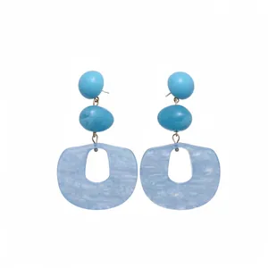 Blue acrylic geometric drop earrings with three-tiered oval and hollowed-out pendant