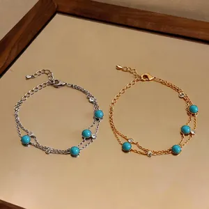 Elegant double-layered turquoise bracelets in gold and silver finishes with dainty stones