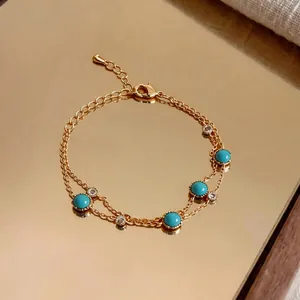 Elegant vintage gold double-chain bracelet with round turquoise and clear zirconia stones
