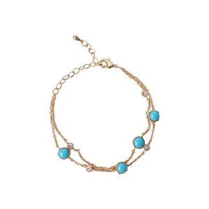 Elegant double-strand gold bracelet with blue turquoise beads and sparkling clear crystals