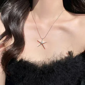 Exquisite silver starfish pendant necklace on model for a minimalist jewelry look