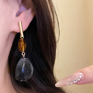 Elegant resin geometric dangling earrings featuring vintage amber and charcoal grey stones