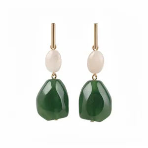Elegant resin geometric drop earrings with green and cream pendants in a vintage style