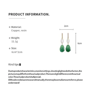 Detailed product information of green resin drop earrings with size and weight metrics