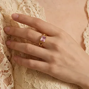 Detail shot of a vintage 18K gold-plated ring featuring a square pink zircon stone
