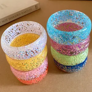Set di bracciali rigidi circolari in resina colorata cangiante con texture glitterata