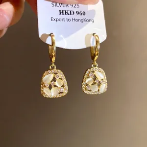Elegant 14k gold plated zircon earrings featuring shimmering cat's eye stone detail