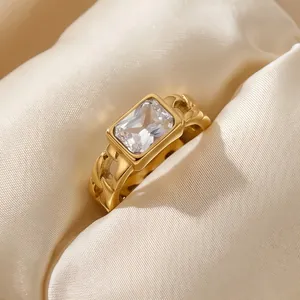 Close-up of vintage stainless steel Cuban link ring with rectangular zircon