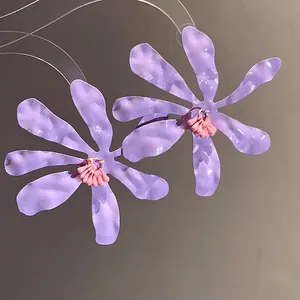 Purple crumpled petal drop earrings with pink stamen and a sweet vacation style vibe