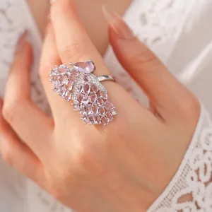 Elegant silver-toned open ring featuring a large pink zircon butterfly wing design