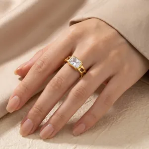 Close-up detail of a vintage gold Cuban chain ring with a sparkling rectangle zircon stone