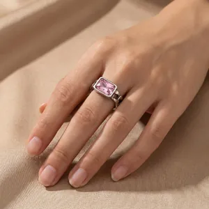Detailed macro view of a silver ring featuring a large pink rectangular zircon