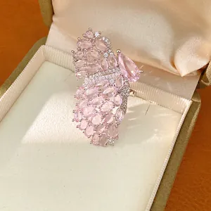 Exquisite close-up of an elegant pink zircon butterfly wing ring inside a luxury display box
