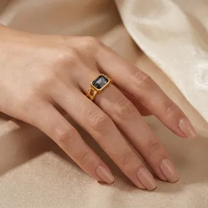 Detailed view of vintage gold-plated stainless steel ring with a smoky emerald-cut zircon