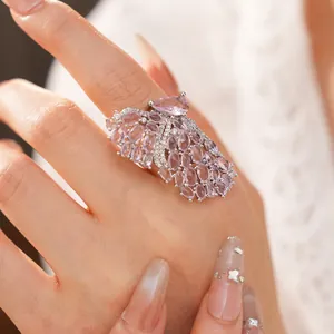 Macro detail view of an elegant butterfly wing ring featuring lavender cubic zirconia stones