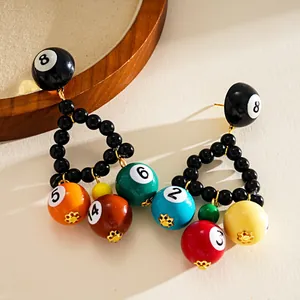 Macro view of creative resin billiard ball triangle dangle earrings for women jewelry