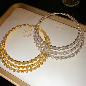 Detailed macro view of three-layer rhinestone chokers in elegant gold and silver.