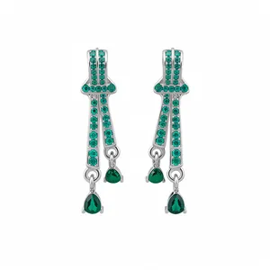 Elegant vintage silver needle earrings featuring emerald green teardrop pendants and crystals