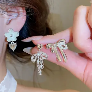 Elegant silver needle bow and heart earrings with pearls and rhinestones for daily wear