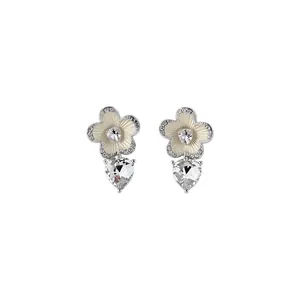 Elegant silver-tone zircon flower stud earrings featuring clear faceted heart crystal drops