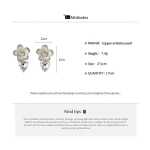Detailed view of flower heart drop earrings with size and material specifications