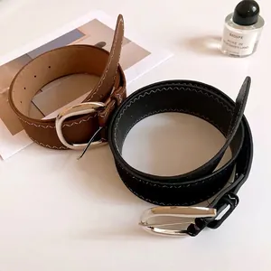 Stylish women's leather belts with silver horseshoe buckles in black and brown colors