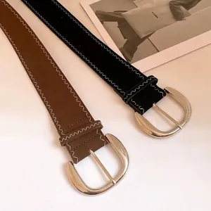 Stylish women's leather belt with silver metal buckle and white contrast stitching