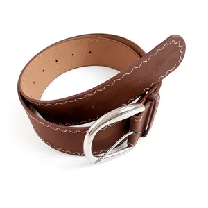 Vintage brown women's faux suede belt with white stitching and oval silver buckle