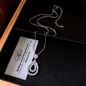 Elegant vintage silver necklace with double teardrop zircon pendant in a black box