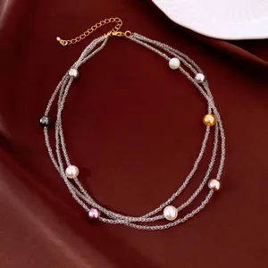 Detail view of a French vintage multi-layer necklace with colorful pearls and crystals
