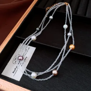 Detailed macro view of a French vintage multi-layer crystal and colorful pearl necklace