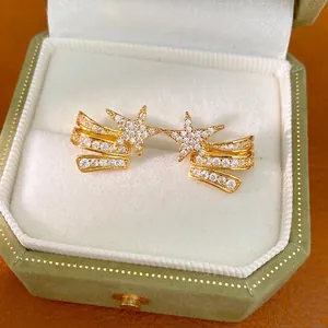 Elegant three-layer star ear clips inlaid with sparkling cubic zirconia in a gold finish